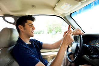 Young Man Texting and Driving